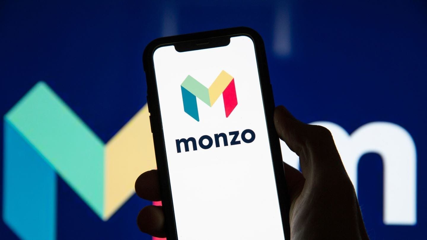 Monzo FCA fine headline with bank logo and compliance documents